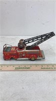 Vintage tin fire truck toy.  Made by K toys in