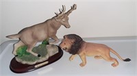 Cast resin  deer figurine and plastic lion.