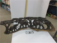 Ornate African wood carving of elephants,