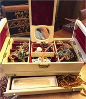 Vintage white box filled with costume jewelry