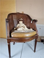 Victorian cane back chair with doll