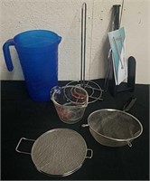 Strainers, glass measuring cup, zipper towel
