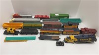 Box of HO scale trains (most are damaged)