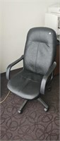 Black office chair and carpet protector