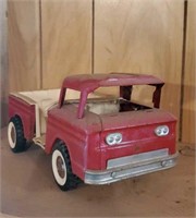 Red Structo toy truck