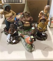 Group of figurines including Tom Clark figures,