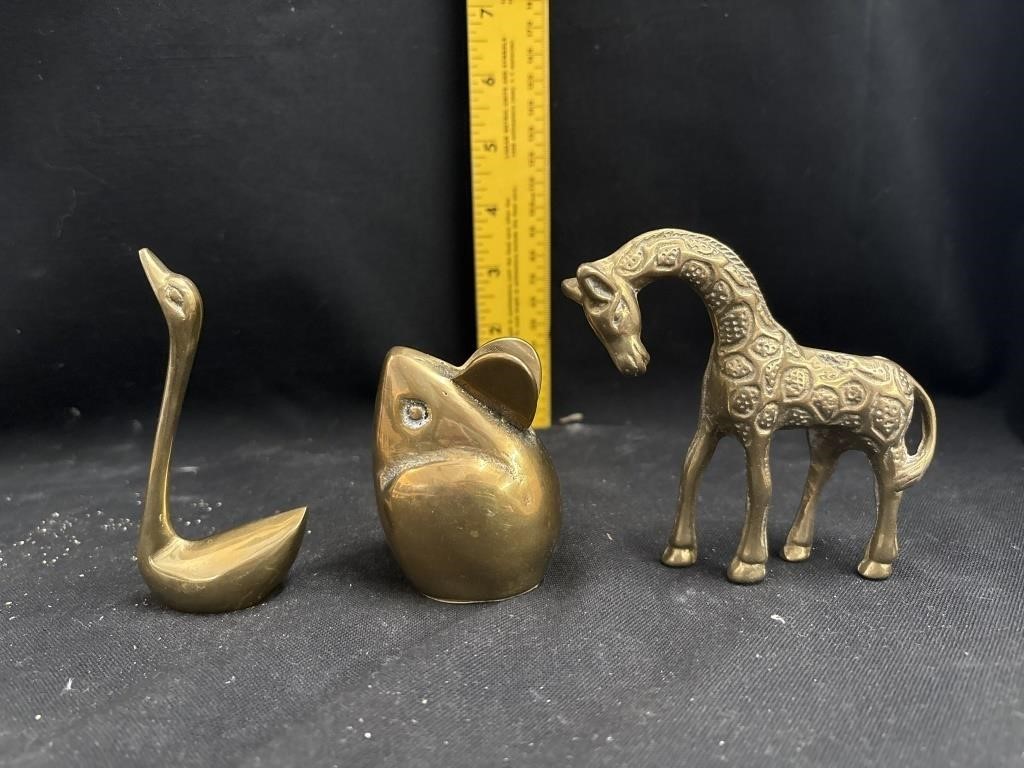 brass figurines and candle holders