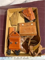 Flat of holsters and ammo pouches