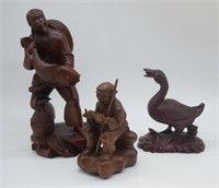 Three oriental carved wooden figures