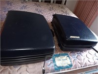 2 vintage Samsonite suitcases on wheels.