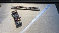 Ratchet straps, level and ruler