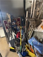 Corner of garden tools mops and brooms