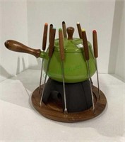 Vintage fondue set includes wooden handled