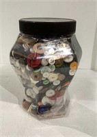 Plastic container filled with buttons - includes
