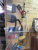 all tools on peg board saw saw blades staple gun