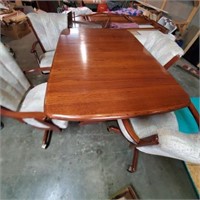 NICE TABLE AND 4 CHAIRS- ( ON CASTERS)