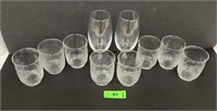 Glass drinking cups and 2 wine glasses.
