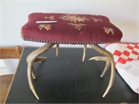 NEEDLE POINT ANTLER FOOT STOOL 18" W 14" H