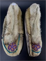 Pair of well worn seal skin slippers, heavily worn