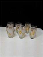 Set of 8 gold colored imprint glasses with