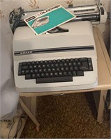 Adler electric typewriter and tin cart
