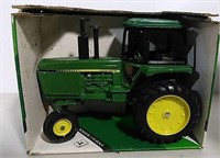 Die-cast John Deere row crop toy tractor