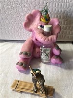Pink elephant hugging Smirnoff bottle