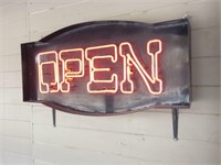 Red neon open sign mounted to building