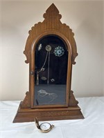 Antique clock case with contents