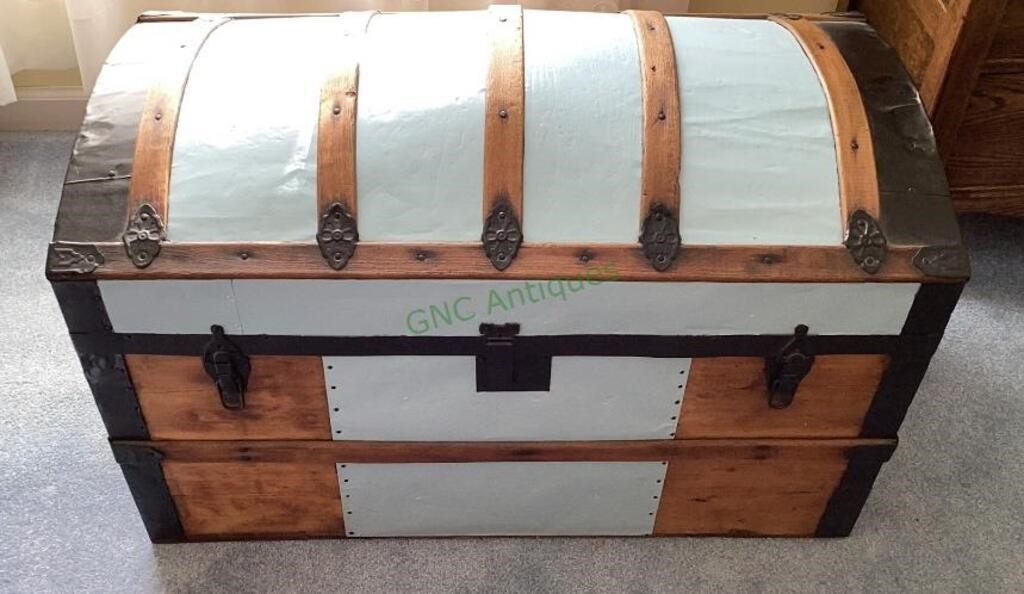 Antique steamer trunk with metal accents and