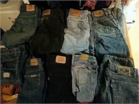 9 pair of used Levi Strauss blue jeans in