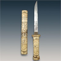 A Finely Carved Japanese Bone Knife And Sheath