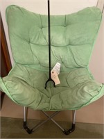 Green plush folding chair, with extended grip