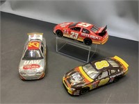 Three model racing cars