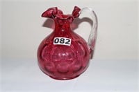 Cranberry colored glass pitcher