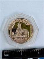 Iowa state seal, copper coin in case