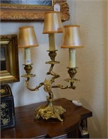 Pair of gilt brass three branch table lamps