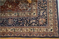 Teal, burgundy, and navy ground Tabriz rug