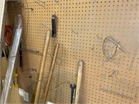 CONTENTS OF PEGBOARD INCLUDING HAND SAW, LEVEL AND