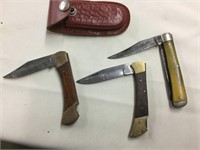 Three old knives one with a case