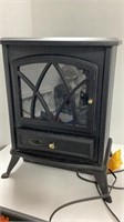 Fireplace style electric space heater. Powers on