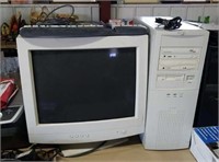 Computer tower, monitor and keyboard
