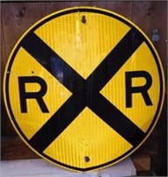 Retired reflective metal Railroad Crossing road