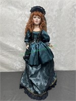 Red Haired porcelain doll with green dress