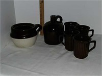 One handle crock, brown jug and four brown mugs