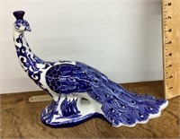 Blue and white ceramic peacock figure