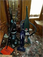 Several vacuums, including a Bissell powersteamer