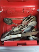 Tin with vintage silverware