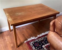 Wood table with self-stored leaves
