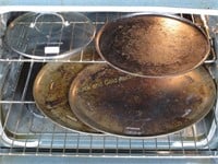 Three Pizza Pans And A Stray Calphalon Lid